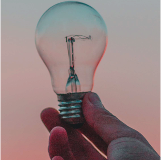 light bulb in the hand of a person
